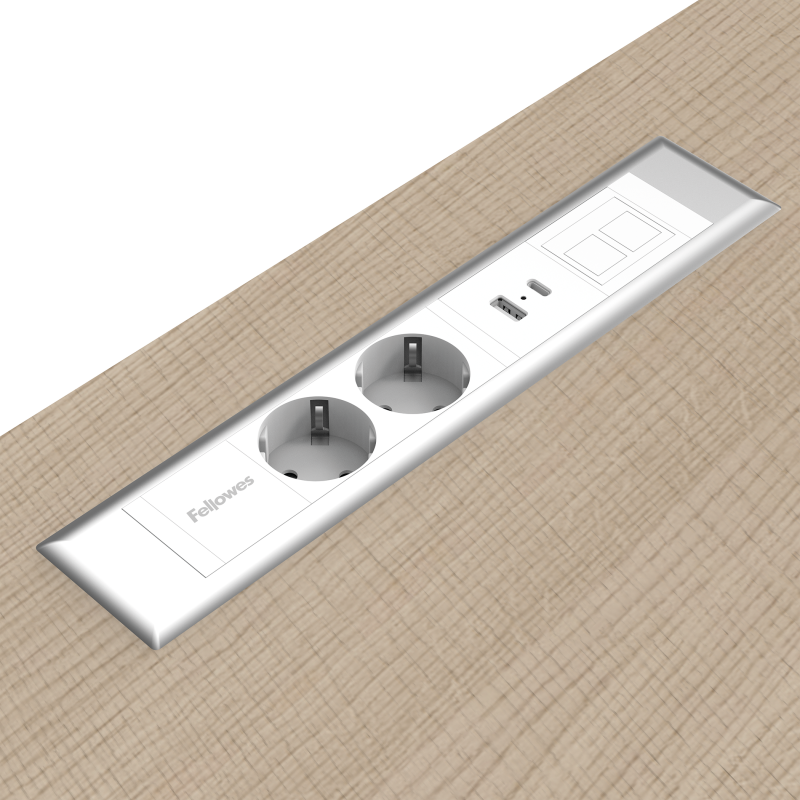 Lange rechthoekige Desk Insert die vlak in bureaus en andere meubels past. De unit heeft twee 230V poorten, een USB-poort en een modulaire keystone poort. De behuizing is wit met een zilveren rand.