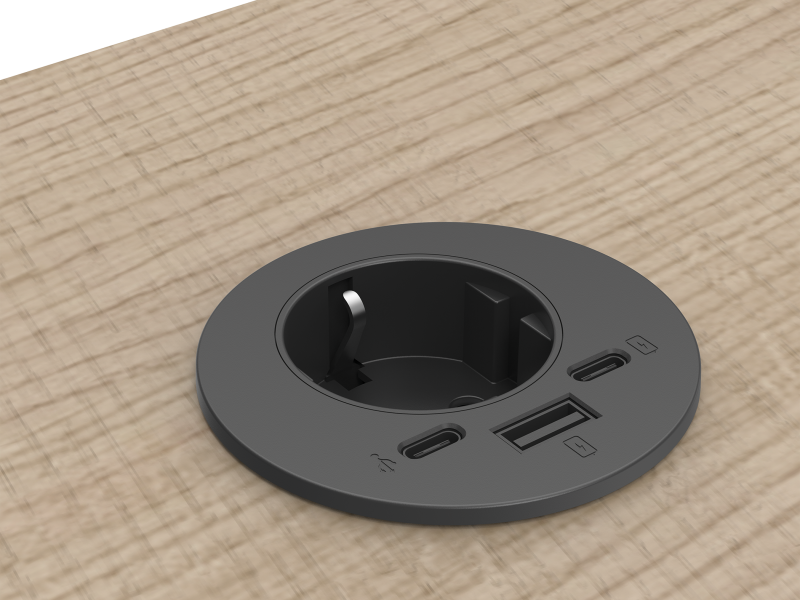Zwarte power-spot klein formaat ingebouwd in bureaublad met een stopcontact en USB-A poort en twee keer een USB-C poort